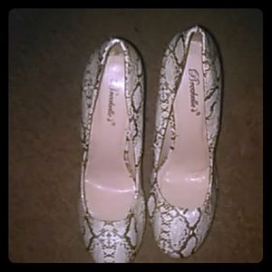 Snake skin heels with tan and black... $30